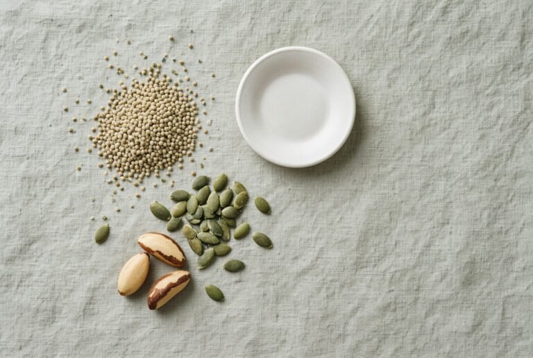 Hemp seeds, pumpkin seeds and Brazil nuts on linen.